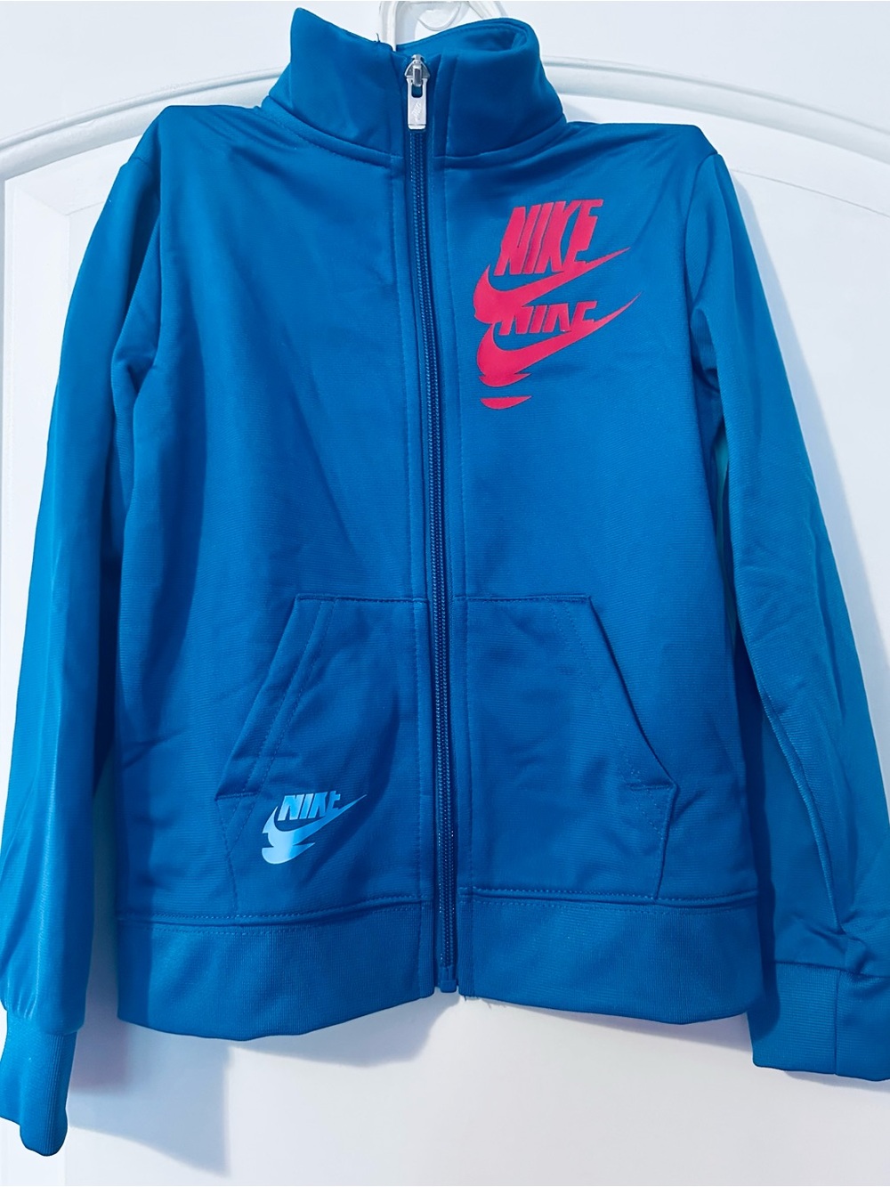 BNWT Nike Kids Blue 2-Piece Track Set with Red Blue and Yellow Logo - Picture 1 of 3